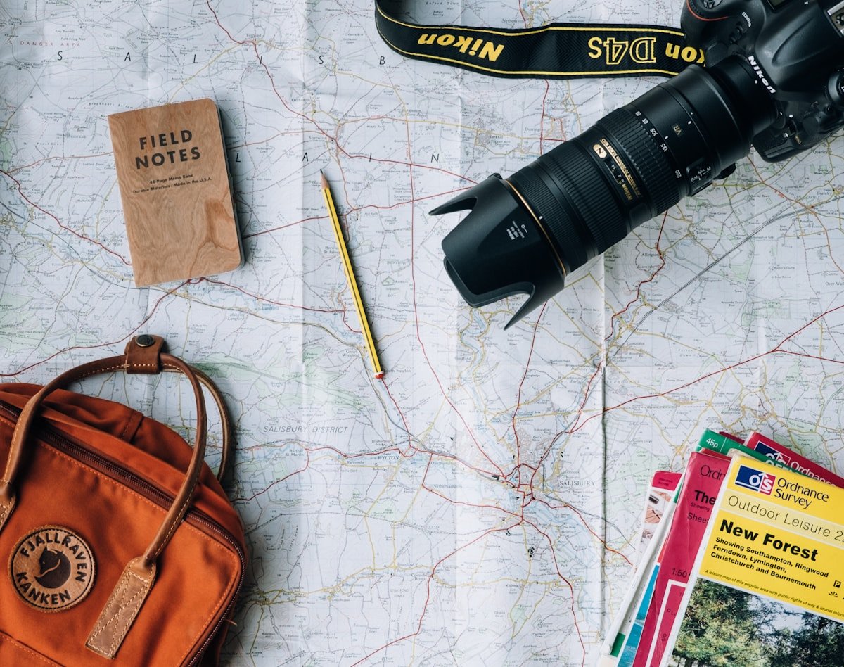 Map, field notebook, camera, and travel bag